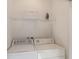 The Laundry room is equipped with modern appliances and a storage shelf for added convenience at 3001 Red Ginger Rd, Kissimmee, FL 34747