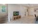 Light and bright living room with staircase, tile flooring, neutral colors, and open floor plan at 3001 Red Ginger Rd, Kissimmee, FL 34747