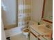 Cozy bathroom with a tub, patterned shower curtain, and vanity with ample counter space at 3166 S Semoran Blvd # 1007, Orlando, FL 32822