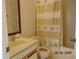 Bright bathroom with a vanity, toilet, and shower-tub combo, ideal for relaxation at 3166 S Semoran Blvd # 1007, Orlando, FL 32822