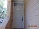 Inviting front door with an arched window on a house with vinyl siding at 3166 S Semoran Blvd # 1007, Orlando, FL 32822