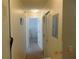 Hallway with carpet and doorways into bedrooms at 3166 S Semoran Blvd # 1007, Orlando, FL 32822