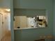Bright kitchen featuring appliances, cabinets, and a convenient pass-through to the dining area at 3166 S Semoran Blvd # 1007, Orlando, FL 32822