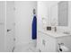 Bathroom with white vanity, marble tile flooring and walls, and modern fixtures at 348 Famagusta Dr, Davenport, FL 33896