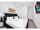 Modern bedroom features a queen bed, accent lighting, and a wall-mounted television at 348 Famagusta Dr, Davenport, FL 33896