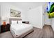 Comfortable bedroom featuring a queen-sized bed, a desk, and a wall-mounted television at 348 Famagusta Dr, Davenport, FL 33896