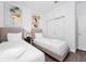 Tastefully decorated bedroom featuring two twin beds, closet, and modern decor for a comfortable stay at 348 Famagusta Dr, Davenport, FL 33896