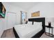 Well-lit bedroom featuring a plush bed and a wall-mounted TV at 348 Famagusta Dr, Davenport, FL 33896