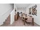 Elegant dining area leading to a modern kitchen, perfect for gatherings and everyday meals with Gathering and friends at 348 Famagusta Dr, Davenport, FL 33896