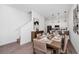 Tastefully designed dining area that flows into an open-concept kitchen, creating a warm and inviting space at 348 Famagusta Dr, Davenport, FL 33896