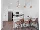 Modern kitchen featuring stainless steel appliances, a breakfast bar, and ample counter space for food preparation and casual dining at 348 Famagusta Dr, Davenport, FL 33896