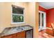 This bar area has a granite countertop and a mini fridge at 4107 Gabriella Ln, Winter Park, FL 32792