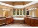 Spacious primary bathroom featuring dual vanities, a soaking tub, and abundant natural light at 4107 Gabriella Ln, Winter Park, FL 32792