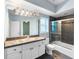 Bathroom features black tile accents, modern vanity and shower/tub combo at 4107 Gabriella Ln, Winter Park, FL 32792