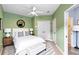 Inviting bedroom with a ceiling fan, double closet, and easy access to the bathroom at 4107 Gabriella Ln, Winter Park, FL 32792