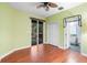 This room features hardwood floors, a sliding door, and an en suite bathroom at 4107 Gabriella Ln, Winter Park, FL 32792