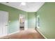 This carpeted bedroom features green walls and an en suite bathroom at 4107 Gabriella Ln, Winter Park, FL 32792