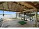 Wooden boat dock and lift overlooking the serene lake and boat storage at 4107 Gabriella Ln, Winter Park, FL 32792