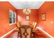 Formal dining room features wood floors, decorative chandelier and space for six at 4107 Gabriella Ln, Winter Park, FL 32792