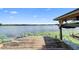 Charming wooden dock offering serene lake views and equipped with a convenient boat lift at 4107 Gabriella Ln, Winter Park, FL 32792