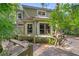Two-story home with wood deck, surrounded by lush greenery and mature trees in a secluded setting at 4107 Gabriella Ln, Winter Park, FL 32792