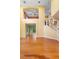 Bright foyer with hardwood floors leading to the upstairs and backyard at 4107 Gabriella Ln, Winter Park, FL 32792