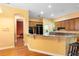 Updated kitchen with granite countertops, stainless steel appliances, hardwood floors, and breakfast bar at 4107 Gabriella Ln, Winter Park, FL 32792