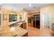 A spacious kitchen featuring wood floors, a granite countertop, and modern stainless steel appliances at 4107 Gabriella Ln, Winter Park, FL 32792