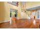 Large living room with fireplace and stairs to the second floor, wood floors, and an open floor plan at 4107 Gabriella Ln, Winter Park, FL 32792