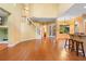 Spacious living room with wood floors, stairs to second floor, and a bar with two stools at 4107 Gabriella Ln, Winter Park, FL 32792