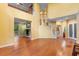 Large living room with fireplace and stairs to the second floor, wood floors, and an open floor plan at 4107 Gabriella Ln, Winter Park, FL 32792