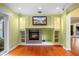 Cozy living room with a fireplace, custom built-ins, and access to the outdoor patio and pool area at 4107 Gabriella Ln, Winter Park, FL 32792