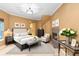 Cozy bedroom featuring a fireplace, neutral colors, and ample natural light at 4107 Gabriella Ln, Winter Park, FL 32792