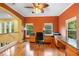 Spacious home office with hardwood floors, custom built-ins, and ample natural light at 4107 Gabriella Ln, Winter Park, FL 32792