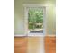 A sliding patio door that leads to an outdoor wooded area with a view to trees and nature at 4107 Gabriella Ln, Winter Park, FL 32792