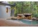 Stunning screened-in pool with a rock waterfall adds a luxurious touch to the outdoor space at 4107 Gabriella Ln, Winter Park, FL 32792