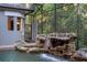 A stunning pool featuring a rock waterfall, enclosed within a screened patio for serene relaxation at 4107 Gabriella Ln, Winter Park, FL 32792