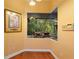 Window with a view of lush landscaping, waterfall feature, and mature trees, bringing the outdoors in at 4107 Gabriella Ln, Winter Park, FL 32792