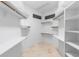 Walk-in closet with built-in shelving and ample storage space at 4107 Gabriella Ln, Winter Park, FL 32792