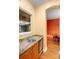 Charming wet bar features granite counters, a sink, and a mini-refrigerator next to the dining room at 4107 Gabriella Ln, Winter Park, FL 32792