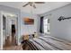 Comfortable bedroom with modern decor, a ceiling fan, and a large window offering plenty of natural light at 425 Eagle Ridge Dr # 425, Davenport, FL 33837