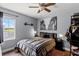 Comfortable bedroom with modern decor, a ceiling fan, and a large window offering plenty of natural light at 425 Eagle Ridge Dr # 425, Davenport, FL 33837