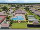 Aerial view of community amenities with a pool, tennis courts, shuffleboard, and clubhouse at 425 Eagle Ridge Dr # 425, Davenport, FL 33837