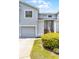 Exterior of a charming townhouse showcasing the architecture and well-maintained landscaping at 425 Eagle Ridge Dr # 425, Davenport, FL 33837