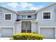 Exterior of a charming townhouse showcasing the architecture and well-maintained landscaping at 425 Eagle Ridge Dr # 425, Davenport, FL 33837