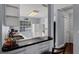 Bright kitchen featuring granite countertops, white cabinets, stainless sink and appliances, and a window with a view at 425 Eagle Ridge Dr # 425, Davenport, FL 33837