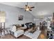 Spacious living room with a vaulted ceiling, dark wood floors, and bright, natural light at 425 Eagle Ridge Dr # 425, Davenport, FL 33837