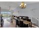 A bright living room and dining area with a view of the lake and golf course at 425 Eagle Ridge Dr # 425, Davenport, FL 33837