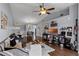 Spacious living room with a vaulted ceiling, dark wood floors, and bright, natural light at 425 Eagle Ridge Dr # 425, Davenport, FL 33837