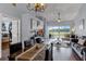 A bright living room and dining area with a view of the lake and golf course at 425 Eagle Ridge Dr # 425, Davenport, FL 33837